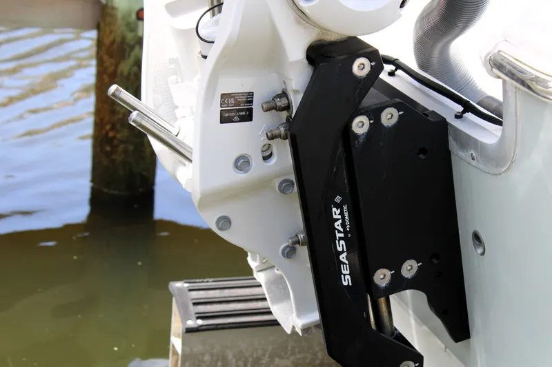 Slide: The Image of Close-up of SeaStar hydraulic steering on 2022 Sea Hunt BX25FS boat. - 7