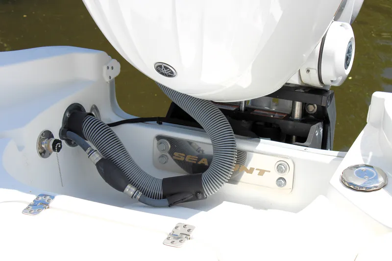 Slide: The Image of 2022 Sea Hunt BX25FS boat engine compartment with hoses and fittings. - 41