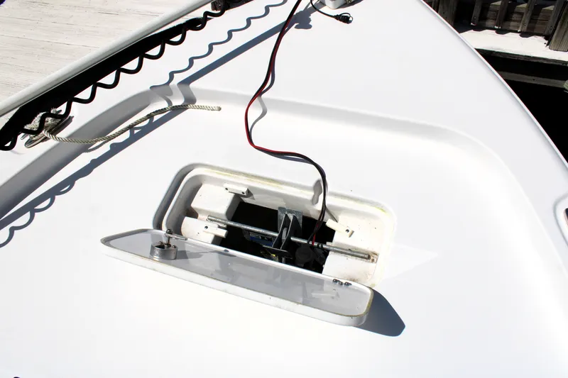 Slide: The Image of 2022 Sea Hunt BX25FS boat deck with open hatch and wiring visible. - 40