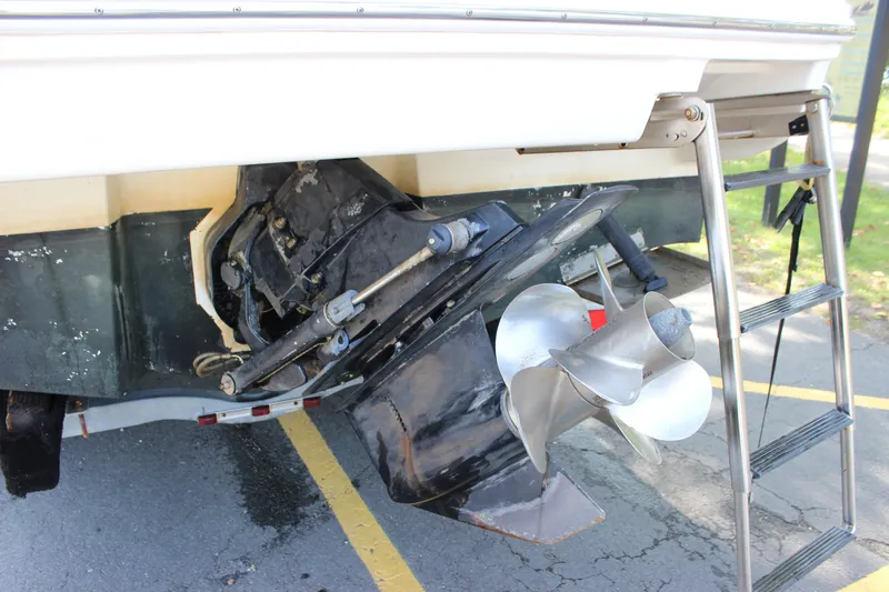 Slide: The Image of 2007 Sea Ray 240 Sundancer boat stern with propeller and ladder. - 36
