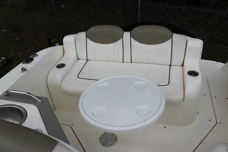 Slide: The Image of 2007 Sea Ray 240 Sundancer boat interior with seating and table. - 17