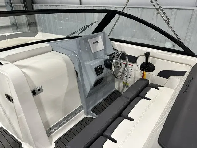 Slide: The Image of The image shows the cockpit of a 2025 Trophy T22SC boat with modern controls. - 17