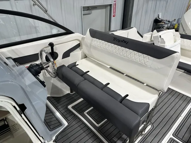 Slide: The Image of The image shows the cockpit of a 2025 Trophy T22SC with gray and white seating. - 35