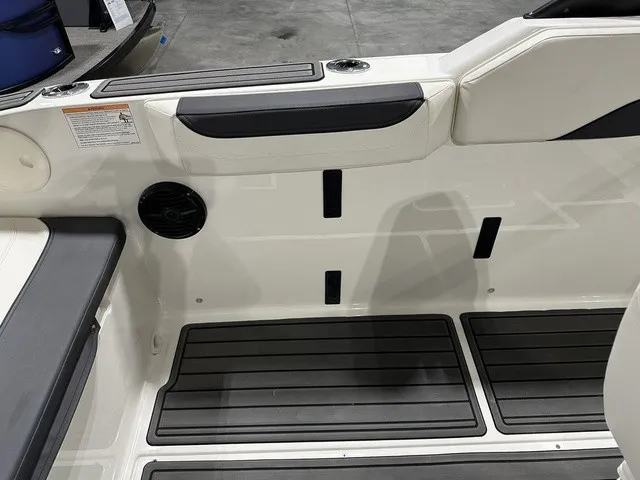 Slide: The Image of The image shows a boat interior with black flooring and white side panels. - 13