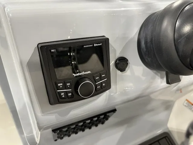 Slide: The Image of Close-up of a boat console area featuring a Bluetooth-enabled radio and controls. - 20