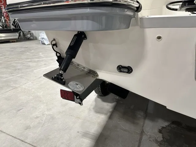 Slide: The Image of The image shows the stern of a 2025 Trophy T22SC boat with a trim tab system. - 5