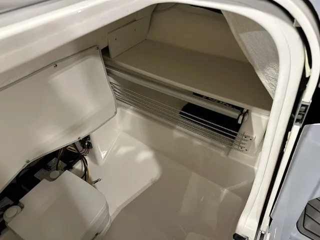 Slide: The Image of Interior of a boat with storage space and wiring. - 26