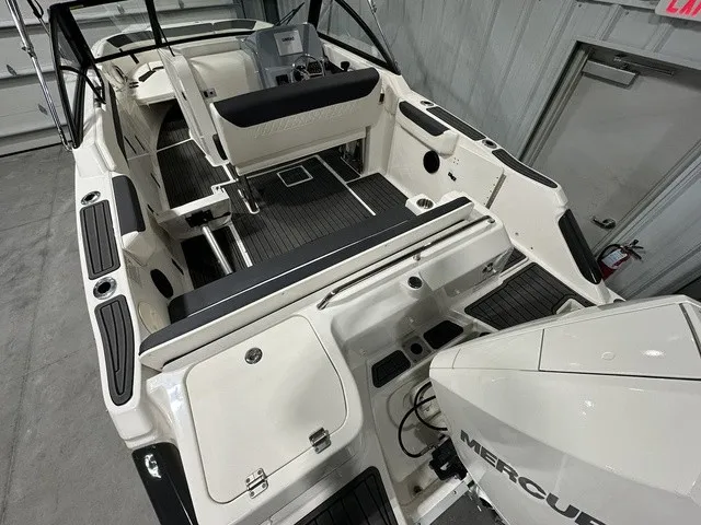 Slide: The Image of The image shows the cockpit of a 2025 Trophy T22SC boat with a Mercury engine. - 8