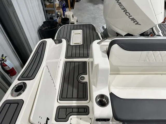 Slide: The Image of The image shows the deck of a 2025 Trophy T22SC boat with gray upholstery and a Mercury engine. - 11