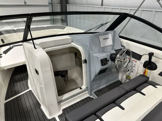 Slide: The Image of The image shows the cockpit of a 2025 Trophy T22SC boat with modern features. - 27