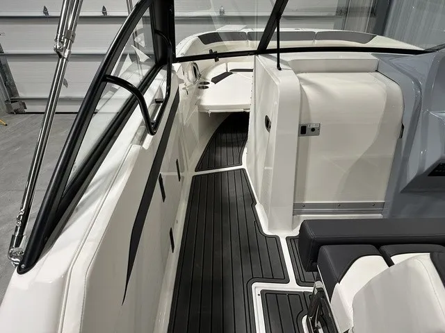 Slide: The Image of The image shows the cockpit of a 2025 Trophy T22SC boat with modern seating and sleek design. - 16