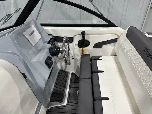 Slide: The Image of The image shows the cockpit of a 2025 Trophy T22SC boat with modern controls. - 18
