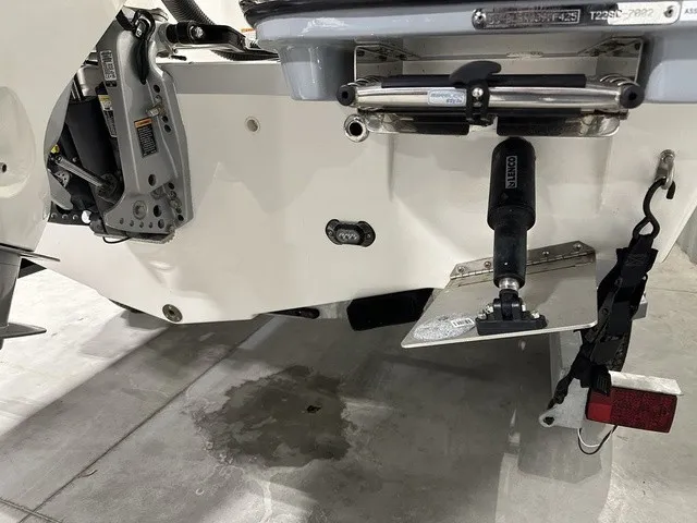 Slide: The Image of Close-up of the stern of a 2025 Trophy T22SC boat with motor and accessories. - 6