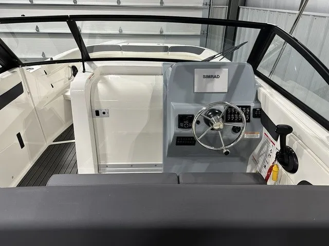 Slide: The Image of The image shows the cockpit of a 2025 Trophy T22SC boat with a Simrad control system. - 15