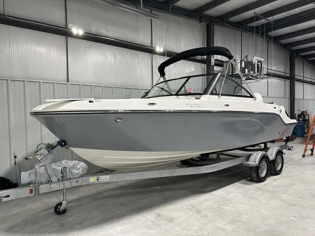Slide: The Image of A 2025 Trophy T22SC boat sits on a trailer in a storage facility. - 3