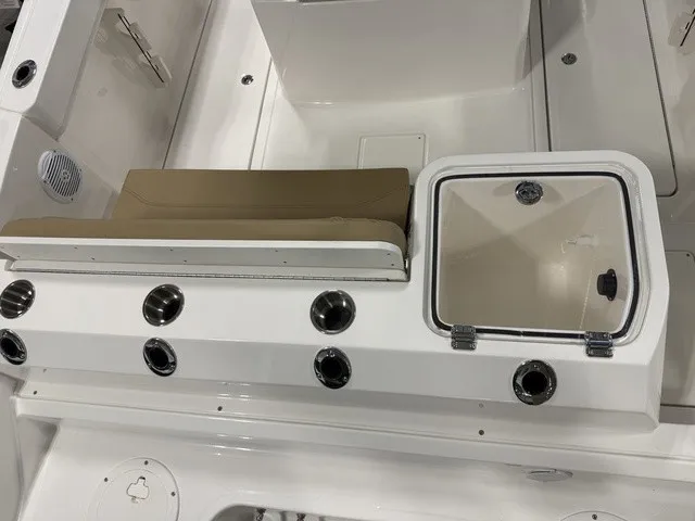 Slide: The Image of The image shows the cockpit of a Trophy T24CC boat with seating and storage. - 8