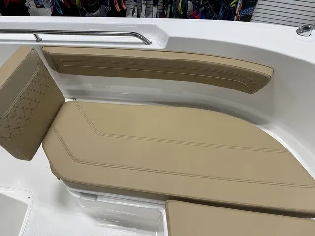 Slide: The Image of The image shows a beige cushioned seating area in a boat, surrounded by white walls. - 27
