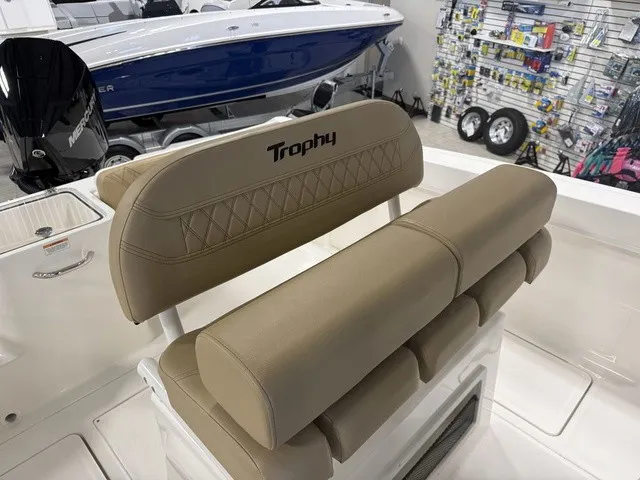 Slide: The Image of The image shows the beige upholstery of the seats on a 2025 Trophy T24CC boat. - 17