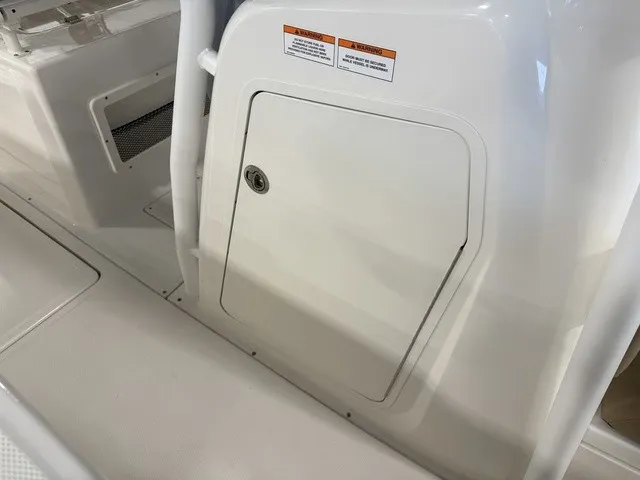 Slide: The Image of The image shows a white boat cabin with a closed door and a small ventilation grille. - 32