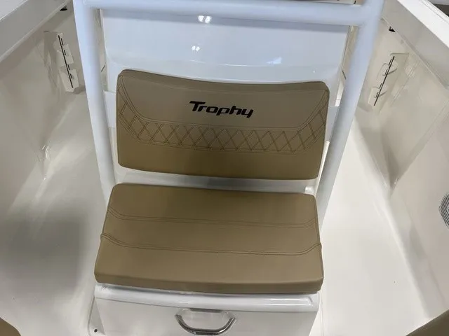 Slide: The Image of Beige seat with "Trophy" logo on a white boat. - 25