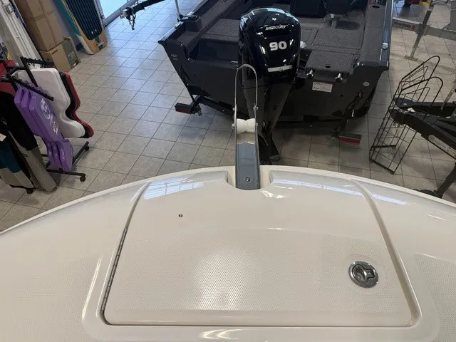 Slide: The Image of The image shows the deck of a 2025 Trophy T24CC boat with an outboard motor. - 30