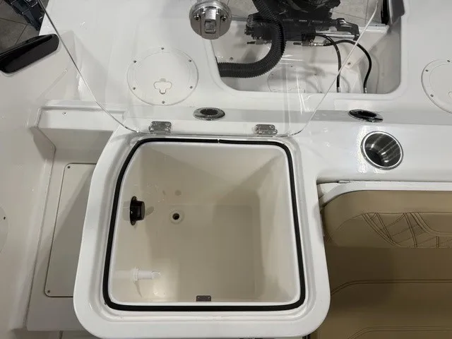 Slide: The Image of The image shows the cockpit of a Trophy T24CC boat with an open storage compartment. - 11