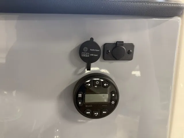 Slide: The Image of The image shows an audio and USB input panel on a boat. - 23