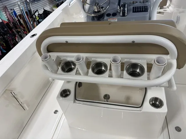 Slide: The Image of The image shows the cockpit of a Trophy T24CC boat with rod holders and a helm console. - 14
