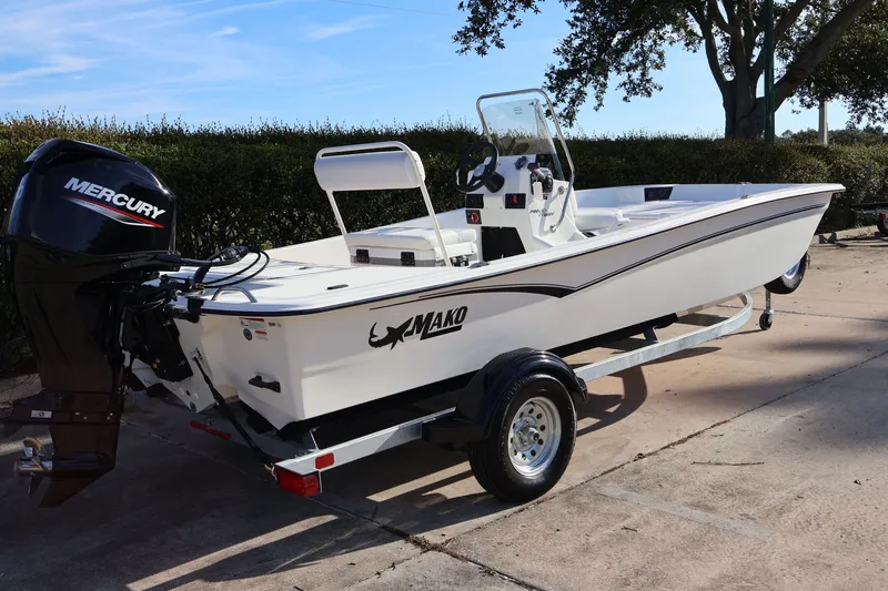 Slide: The Image of 2027 Mako Pro Skiff 17 CC boat on trailer with Mercury outboard motor. - 5