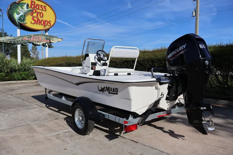 Slide: The Image of 2027 Mako Pro Skiff 17 CC boat with Mercury engine at Bass Pro Shops. - 2