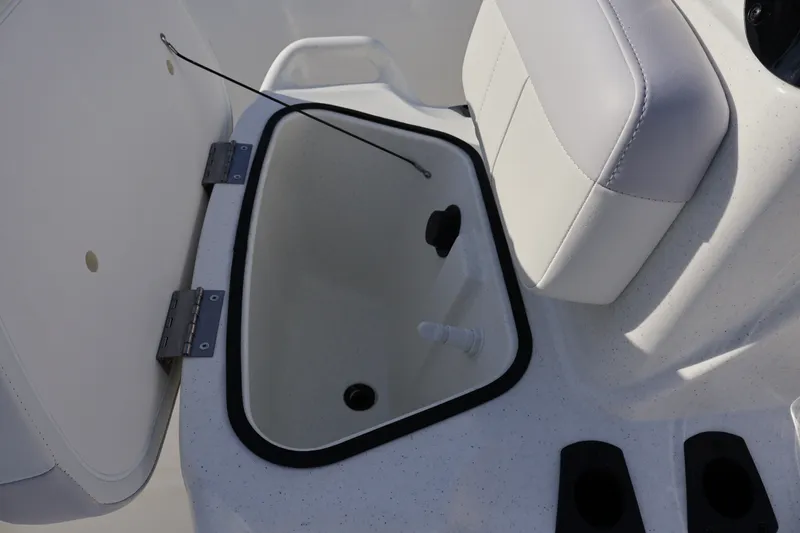 Slide: The Image of Open storage compartment on 2027 Mako Pro Skiff 17 CC boat interior. - 16