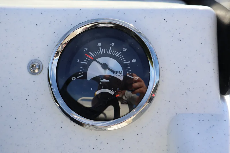 Slide: The Image of Close-up of RPM gauge on 2027 Mako Pro Skiff 17 CC boat dashboard. - 10