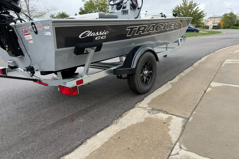 Slide: The Image of 2027 Tracker Bass Tracker Classic CC boat on trailer, parked on street. - 69
