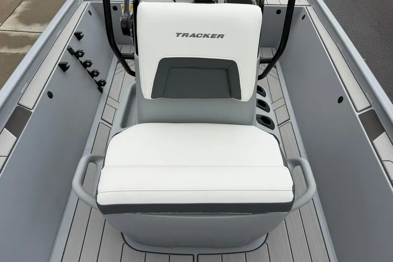 Slide: The Image of 2027 Tracker Bass Tracker Classic CC boat seat, white and gray design, sleek interior. - 16