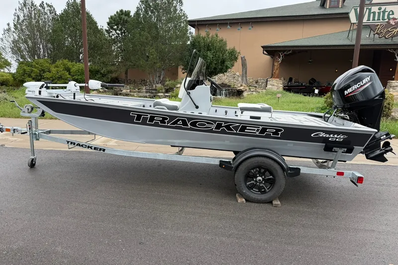 The Image of 2027 Tracker Bass Tracker Classic CC boat on trailer, parked outdoors. - 0
