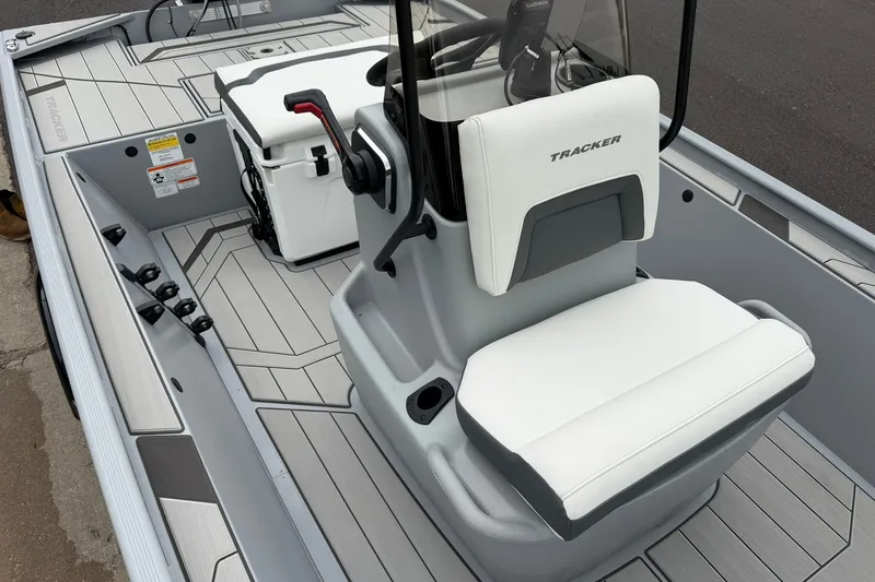 Slide: The Image of 2027 Tracker Bass Tracker Classic CC boat interior with seating and console. - 18