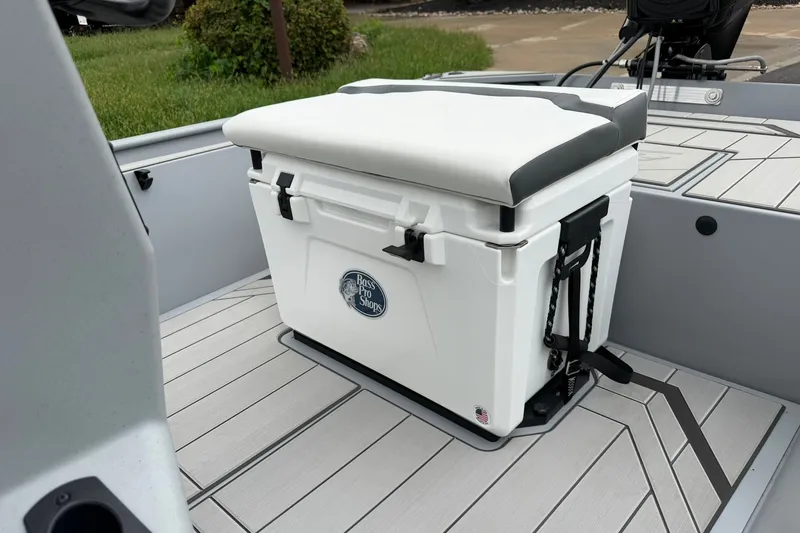 Slide: The Image of 2027 Tracker Bass Tracker Classic CC boat with cushioned cooler seat on deck. - 21