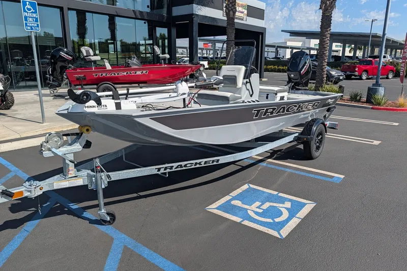 The Image of 2027 Tracker Bass Tracker Classic CC boat on trailer in parking lot. - 0
