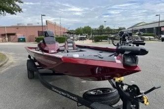 The Image of 2026 Ranger RT178 boat on trailer, parked outdoors, showcasing sleek design and modern features. - 0