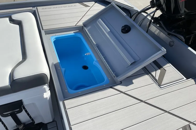 Slide: The Image of 2027 Tracker Bass Tracker Classic CC boat with open storage compartment on deck. - 13
