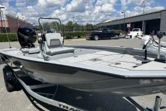 The Image of 2027 Tracker Bass Tracker 175 CC boat in a dealership lot under a cloudy sky. - 0