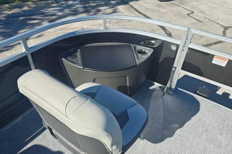 Slide: The Image of 2027 Sun Tracker Fishin' Barge 20 DLX boat interior with seating and console. - 58