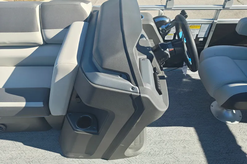 Slide: The Image of 2027 Sun Tracker Fishin' Barge 20 DLX interior with steering console and seating. - 18