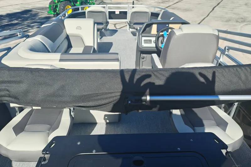 Slide: The Image of 2027 Sun Tracker Fishin' Barge 20 DLX interior with seating and steering console. - 49
