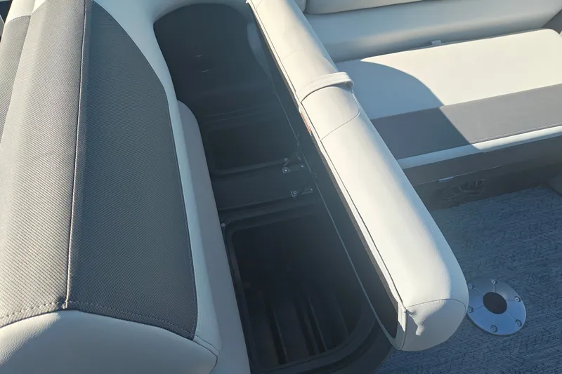 Slide: The Image of 2027 Sun Tracker Fishin' Barge 20 DLX boat seat with open storage compartment. - 26