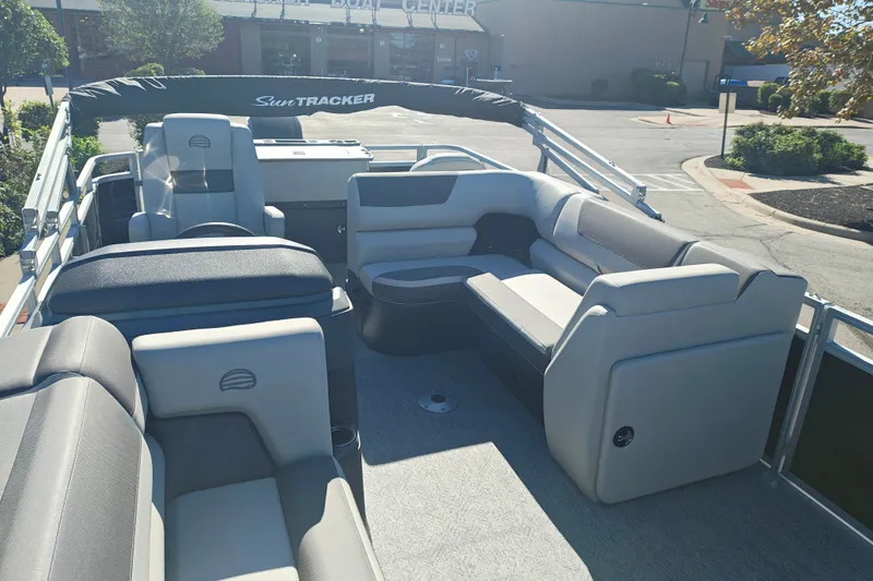 Slide: The Image of 2027 Sun Tracker Fishin' Barge 20 DLX interior with comfortable seating and modern design. - 14