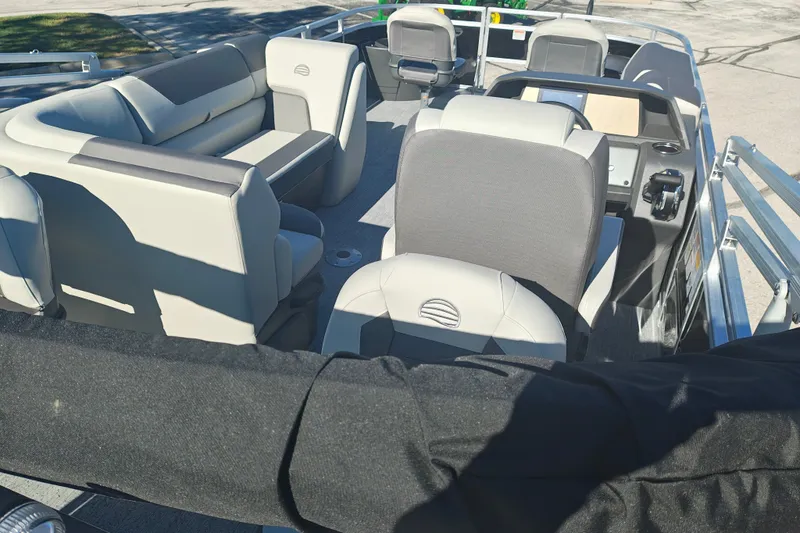Slide: The Image of 2027 Sun Tracker Fishin' Barge 20 DLX interior with comfortable seating and modern controls. - 51