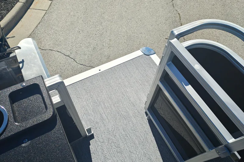 Slide: The Image of 2027 Sun Tracker Fishin' Barge 20 DLX pontoon boat deck and railing detail. - 43