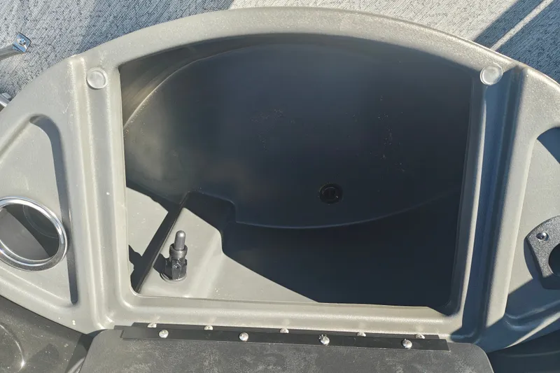 Slide: The Image of Sun Tracker Fishin' Barge 20 DLX 2027 boat compartment with cup holder and fittings. - 60