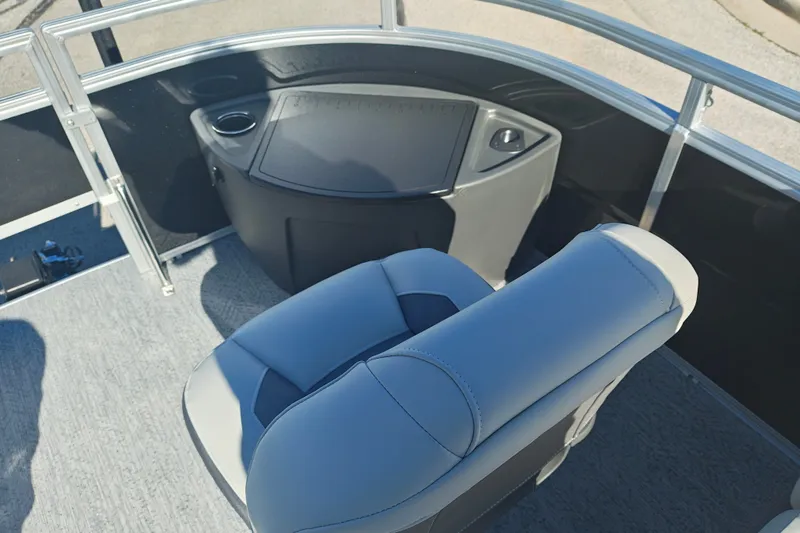 Slide: The Image of 2027 Sun Tracker Fishin' Barge 20 DLX interior with comfortable seating and console. - 55